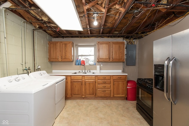 614 Debra Ln, Indianapolis, IN 46217 - washroom with a sink, separate washer and dryer, electric panel, laundry area, and concrete block wall