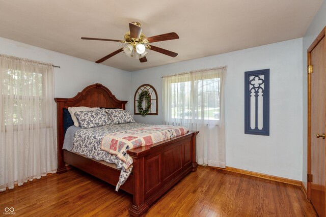 614 Debra Ln, Indianapolis, IN 46217 - bedroom with light wood-style flooring, baseboards, and ceiling fan