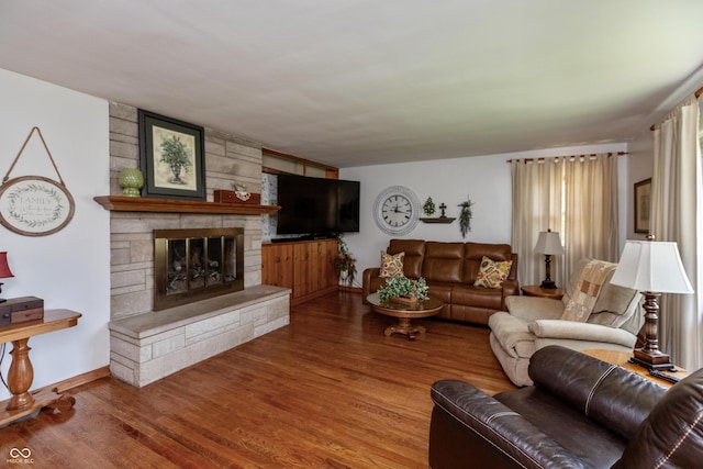 614 Debra Ln, Indianapolis, IN 46217 - living room featuring wood finished floors, baseboards, and a fireplace