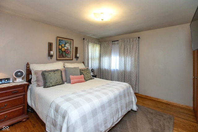 614 Debra Ln, Indianapolis, IN 46217 - bedroom featuring baseboards and dark wood-style flooring