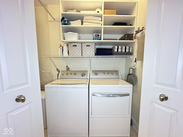 laundry room with washer and clothes dryer and laundry area