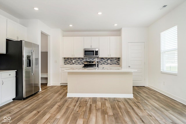 8654 Tripp Rd, Pendleton, IN 46064 - kitchen with stainless steel appliances, backsplash, healthy amount of natural light, light wood-style flooring, and recessed lighting
