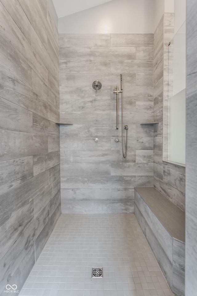 bathroom with a tile shower