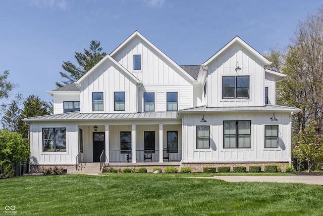modern farmhouse style home featuring a porch, a standing seam roof, and board and batten siding