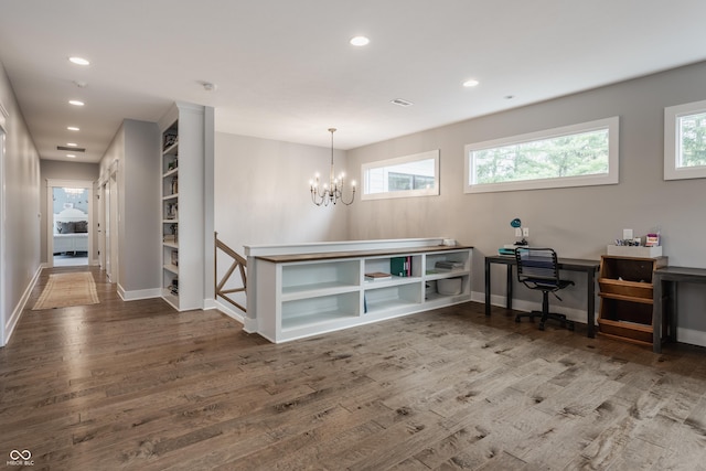 interior space featuring recessed lighting, a notable chandelier, wood finished floors, and a healthy amount of sunlight