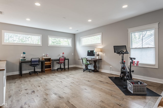 office with baseboards, recessed lighting, wood finished floors, and visible vents