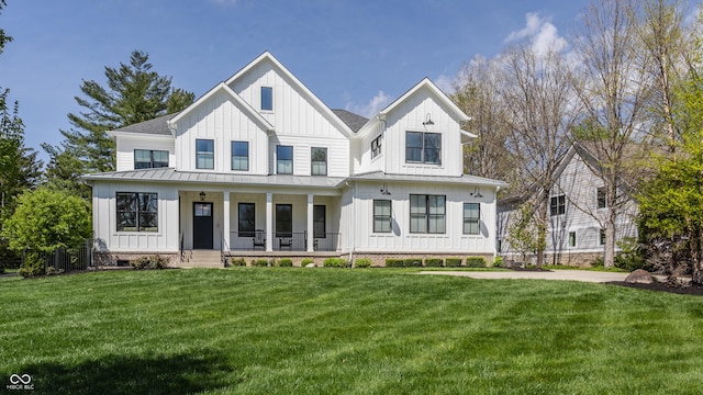 modern farmhouse style home featuring a porch, a standing seam roof, and board and batten siding