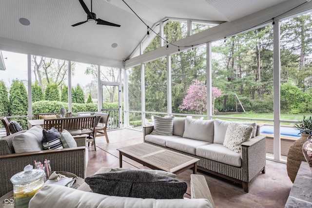 sunroom / solarium with ceiling fan and an outdoor living space