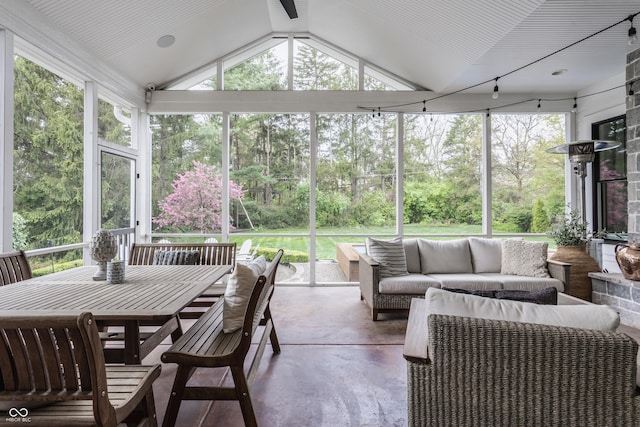 sunroom with an outdoor living space and plenty of natural light
