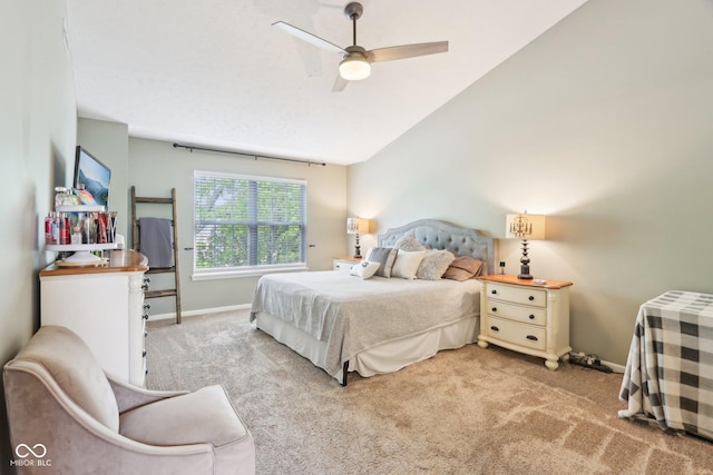 bedroom featuring carpet flooring, baseboards, lofted ceiling, and a ceiling fan