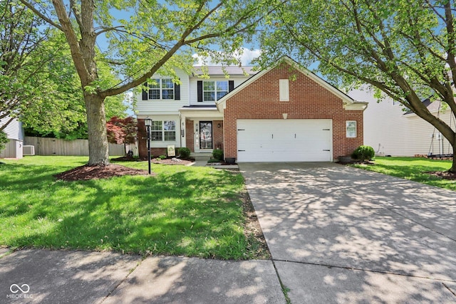 traditional-style house with brick siding, an attached garage, and concrete driveway