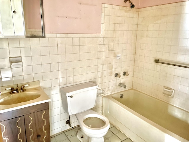 full bathroom with vanity, tile walls, toilet, tile patterned flooring, and bathing tub / shower combination