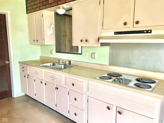 kitchen featuring light countertops, electric cooktop, under cabinet range hood, and a sink