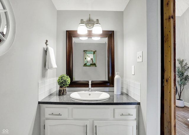 3646 Beach Blvd, Cicero, IN 46034 - bathroom featuring vanity, wood finished floors, and baseboards