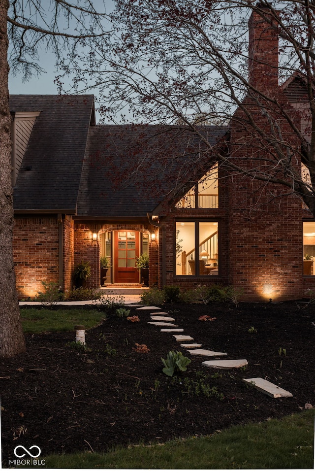 8551 E 300 S, Zionsville, IN 46077 - view of front facade featuring a chimney, a shingled roof, and brick siding
