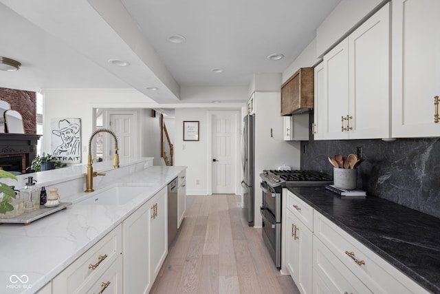 8551 E 300 S, Zionsville, IN 46077 - kitchen with appliances with stainless steel finishes, white cabinets, and a sink