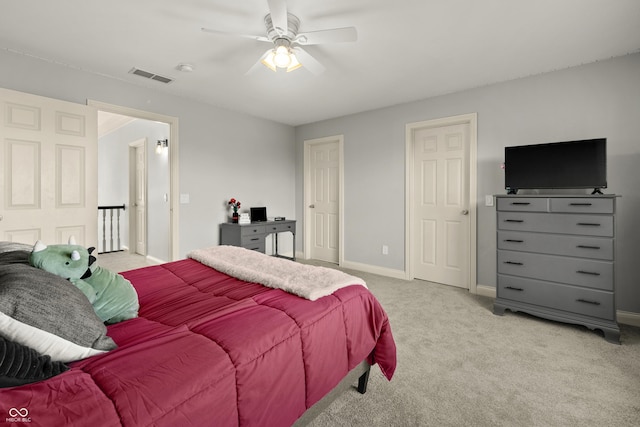 bedroom with visible vents, baseboards, ceiling fan, and light colored carpet