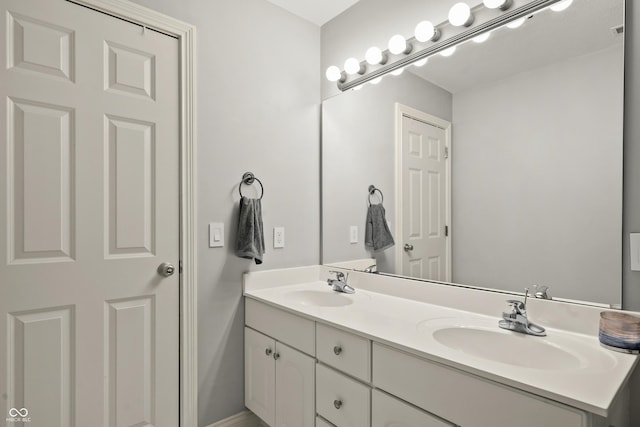 bathroom with double vanity and a sink