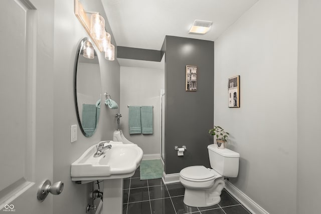 bathroom with a shower stall, tile patterned floors, visible vents, toilet, and baseboards
