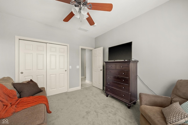 living area with light carpet, a ceiling fan, visible vents, and baseboards
