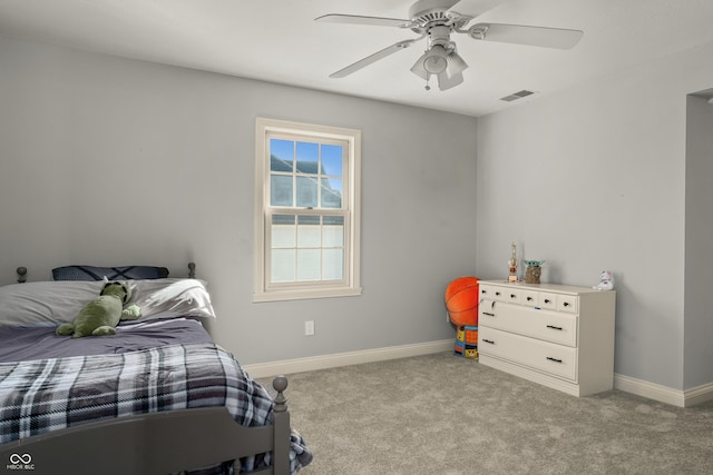 bedroom with baseboards, visible vents, and carpet flooring