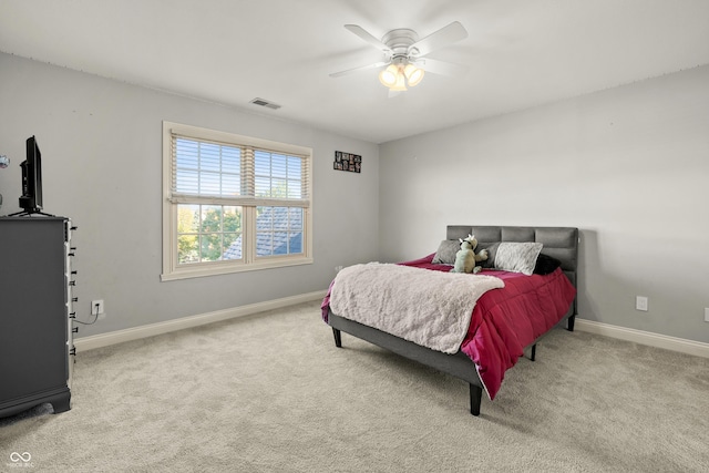 bedroom featuring baseboards, visible vents, carpet flooring, and ceiling fan