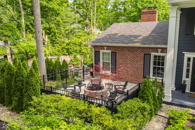654 E 79th St, Indianapolis, IN 46240 - view of patio with a fire pit