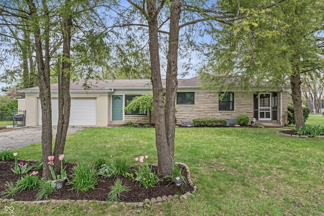 single story home featuring an attached garage, driveway, stone siding, and a front lawn