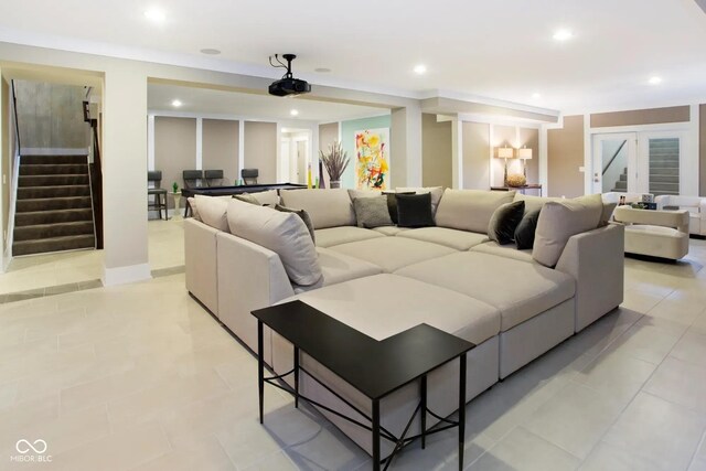 living area with recessed lighting, light tile patterned floors, french doors, and stairs