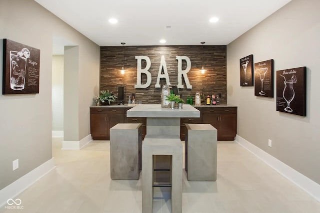 bar featuring backsplash, baseboards, and recessed lighting