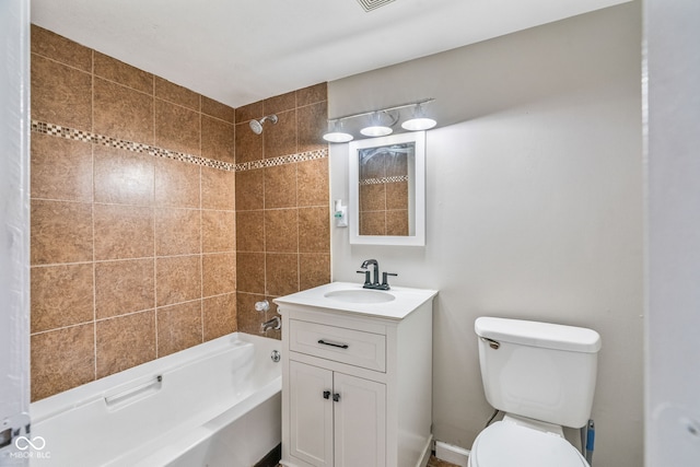 bathroom featuring toilet, vanity, and  shower combination