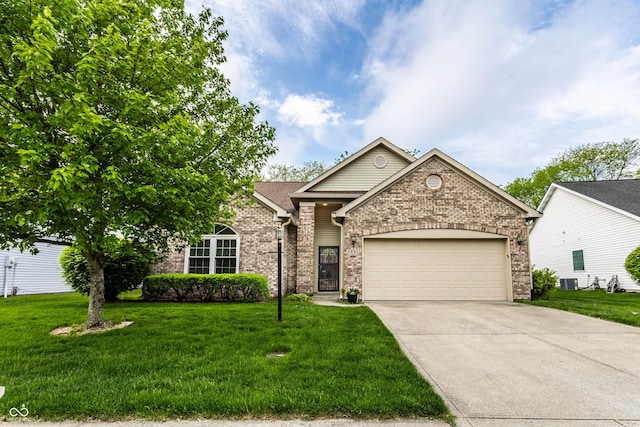 view of front facade with brick siding, a garage, driveway, and a front lawn