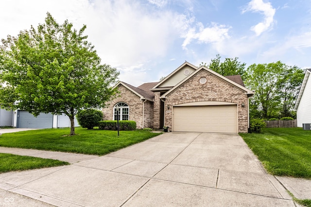 view of front facade with brick siding, concrete driveway, and a garage