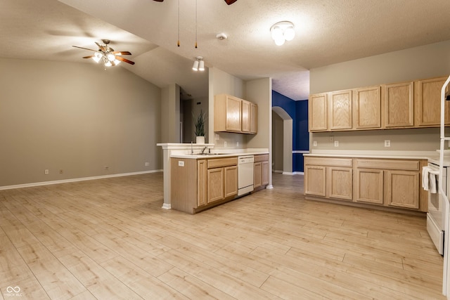kitchen with white appliances, light brown cabinetry, ceiling fan, arched walkways, and vaulted ceiling