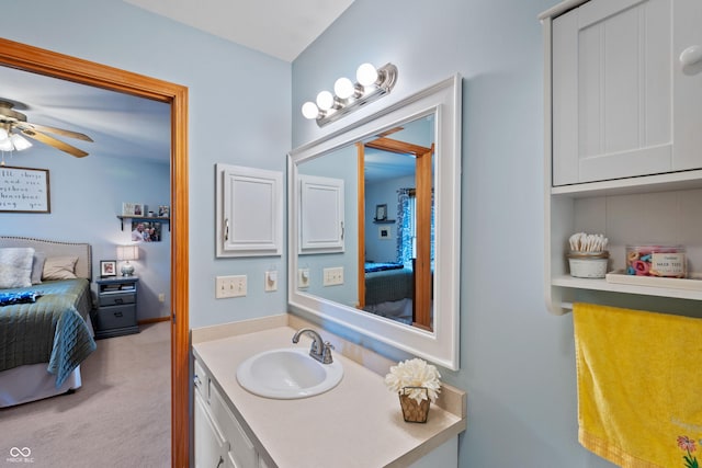 ensuite bathroom featuring ensuite bath, a ceiling fan, and vanity