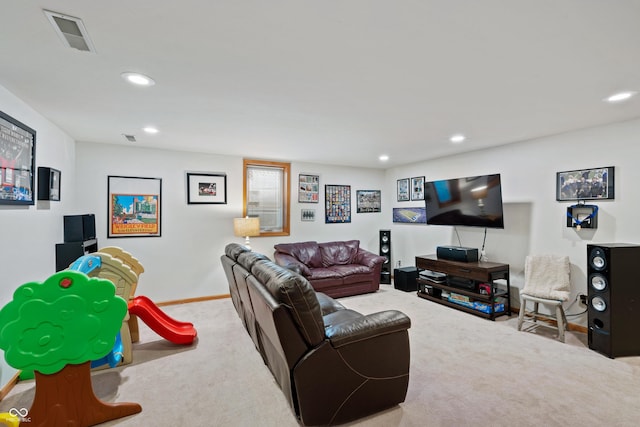 living area with recessed lighting, visible vents, and carpet