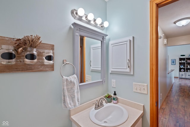 bathroom with vanity and hardwood / wood-style floors