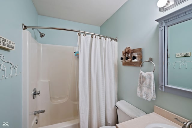 full bath featuring toilet, vanity, and shower / bath combination with curtain