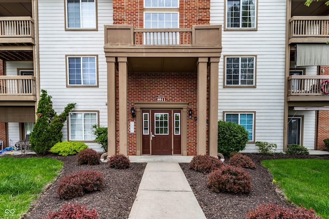 8911 Hunters Creek Dr Unit 311, Indianapolis, IN 46227 - exterior space with brick siding and a balcony
