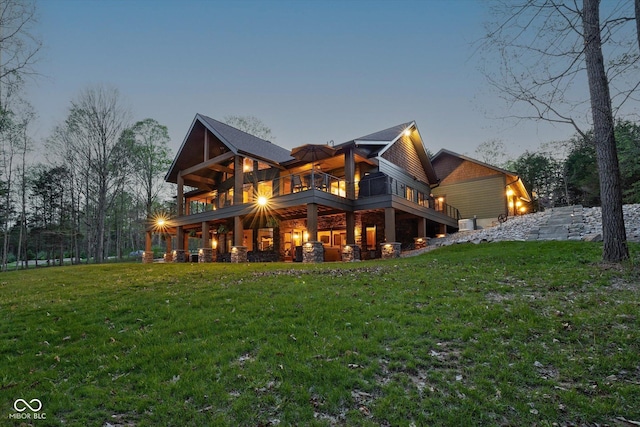 rear view of house with a lawn