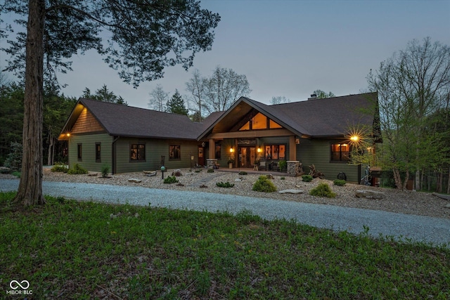 view of front of property with a porch and a shingled roof