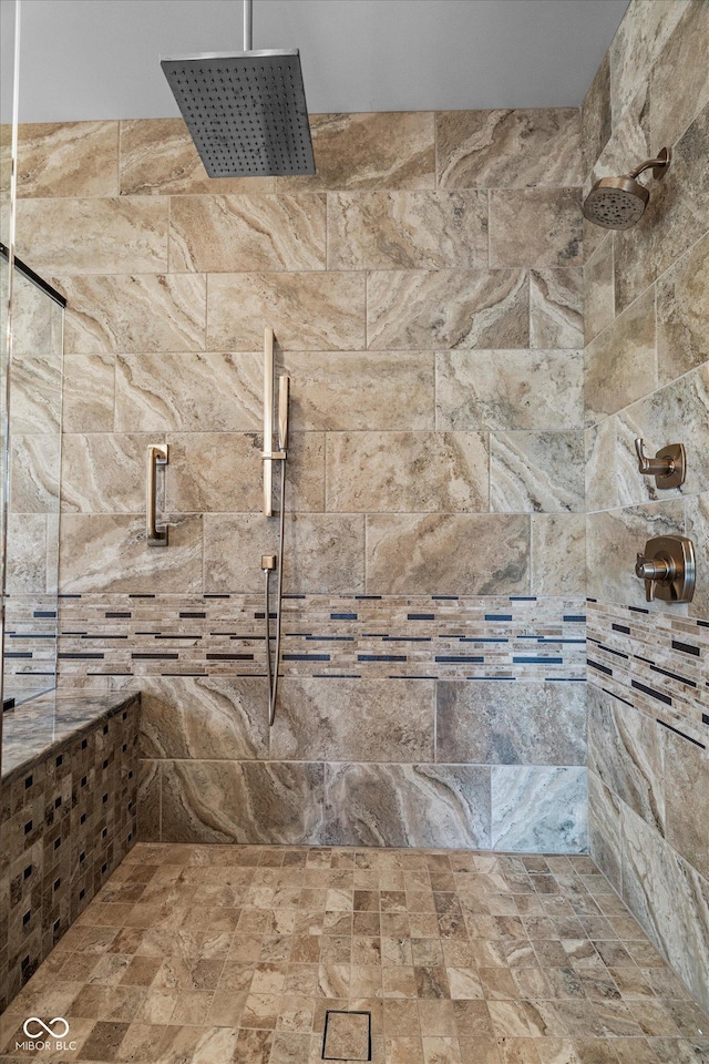 full bathroom with tiled shower