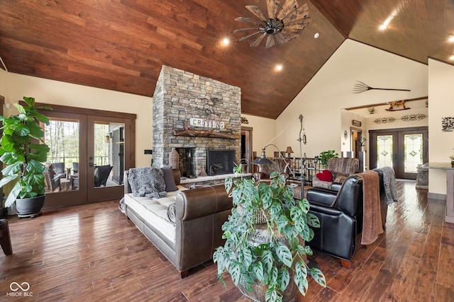 living room with french doors, high vaulted ceiling, hardwood / wood-style floors, a fireplace, and wooden ceiling