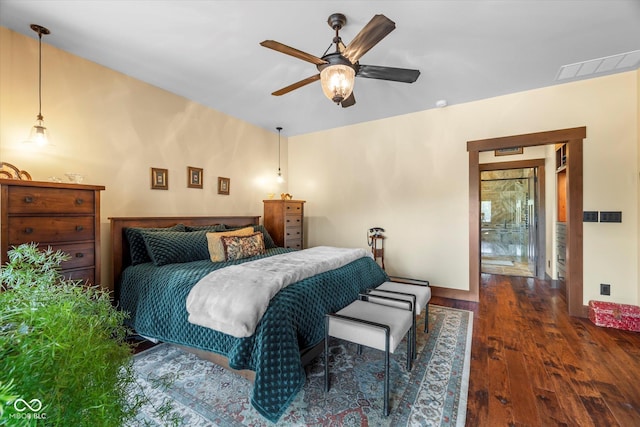 bedroom featuring wood finished floors, baseboards, and ceiling fan