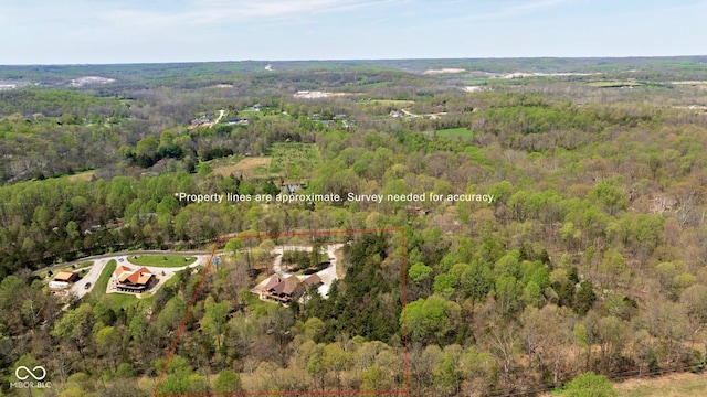 aerial view of property's location with a forest and property boundaries highlighted
