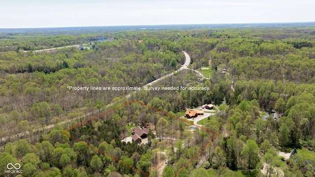 view of property location with a forest and property parcel outlined