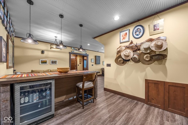 welcome area with a dry bar and recessed lighting