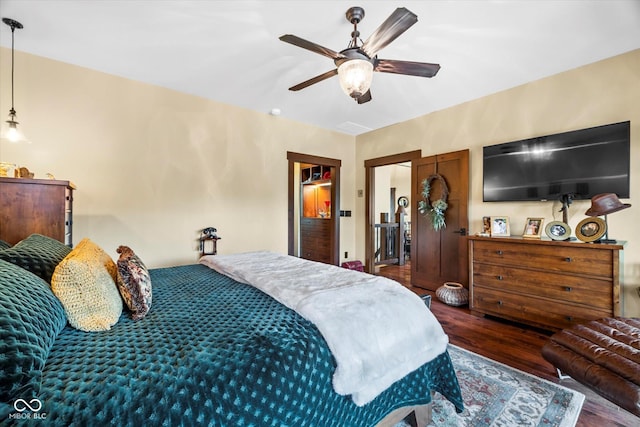 bedroom featuring wood finished floors and ceiling fan