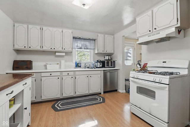 kitchen with dishwasher, white cabinetry, under cabinet range hood, and white gas range oven