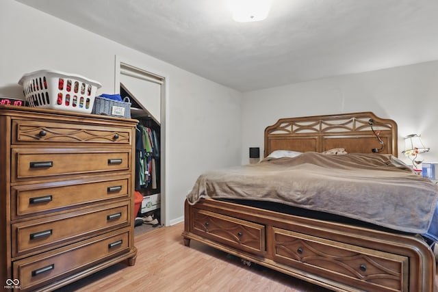 bedroom with light wood finished floors